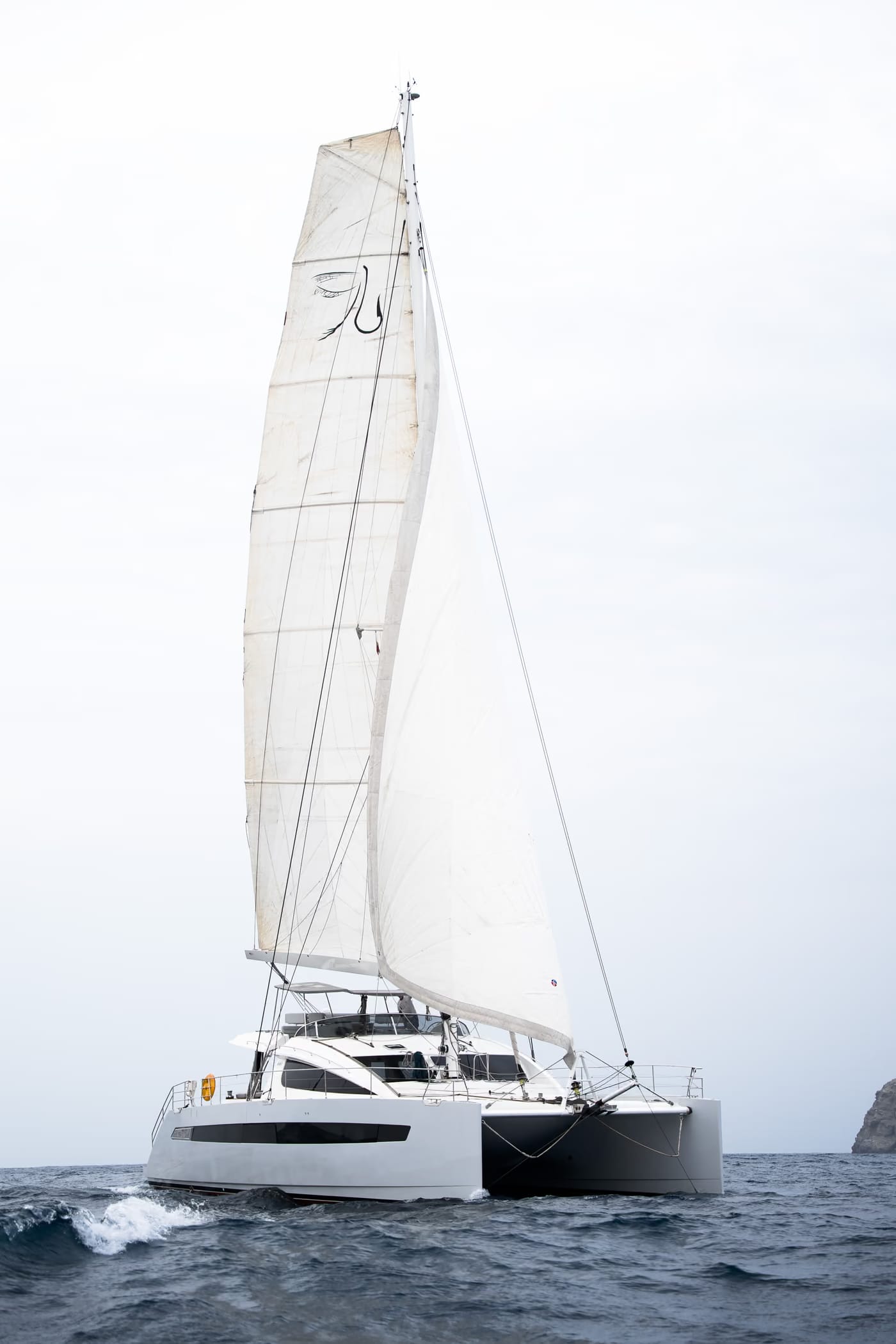 Privilege 640 sailing catamaran under sail at sea