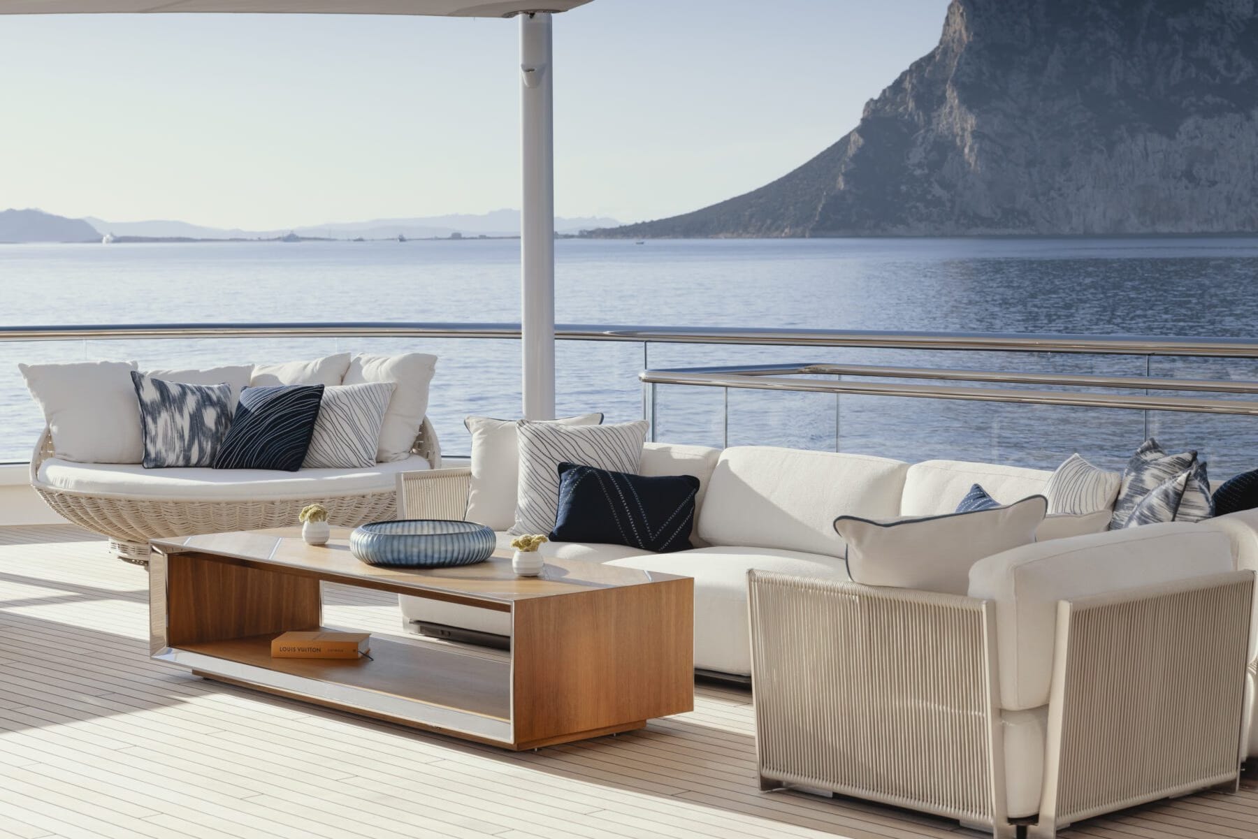Yacht deck overlooking a Mediterranean mountain